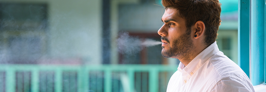 young man smoking cigarette