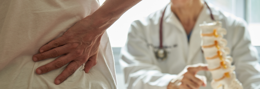 A doctor explaining lumbar anatomy to back pain patient