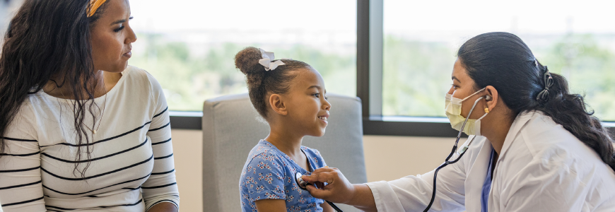 Doctor examines young patient