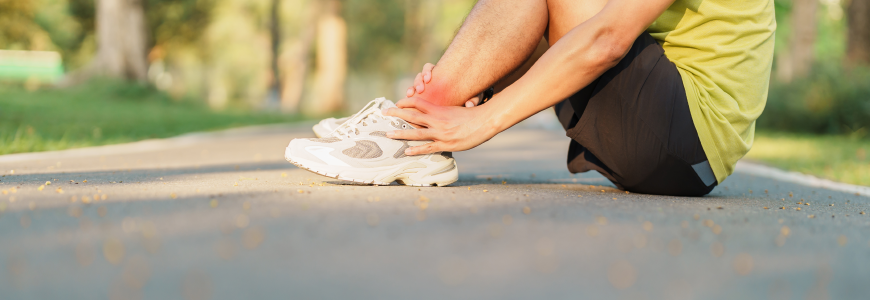 Young adult male with his muscle pain during running.