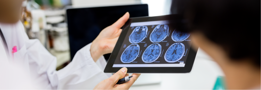 Doctor and patient using digital tablet in hospital