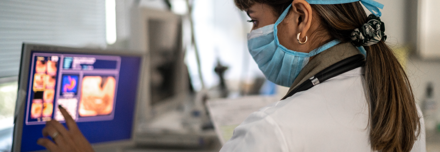 Doctor checking exams in an examination room