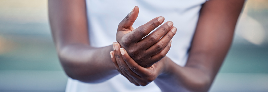 Black woman with a hand injury and pain