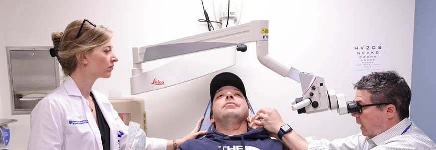 Dr. Kaylie and Ariel examining a patient