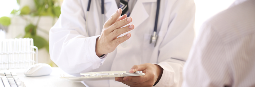 Physician talking with patient
