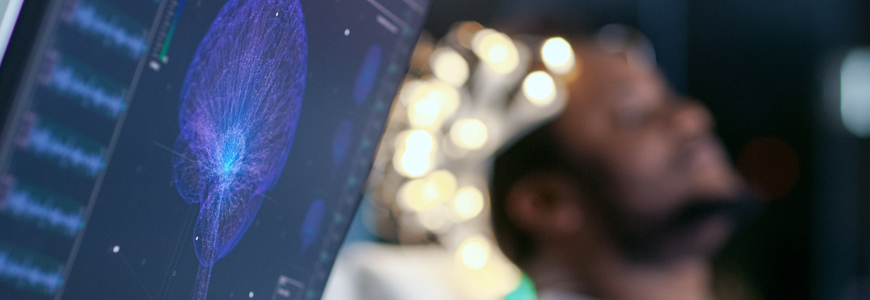photo of monitor with man in the background