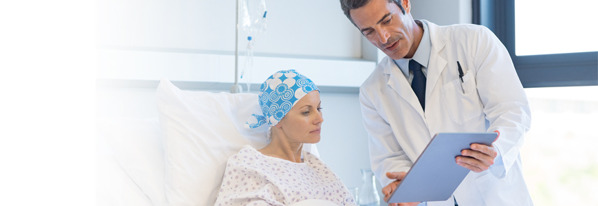 Physician consulting with patient with cancer