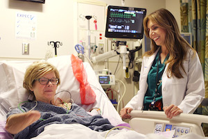 Woman talks with her doctor before surgery.