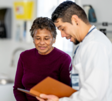 Physician and patient talking in clinic