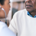 Provider listening to patient's heart