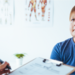 Teenage boy and doctor have a consultation in a clinic room