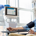 Oncology nurse checking the vital signs of a chemotherapy patient at the hospital