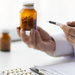 Specialized doctor is explaining taking medicine to a patient.