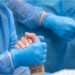 Female surgeon holding patient's hand before surgery