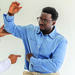 Doctor examines a male patient's shoulder and arm during a clinical consultation