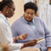 Black female physician talks with female patient