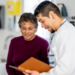Physician and patient talking in clinic