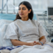 Woman sitting up in a hospital bed