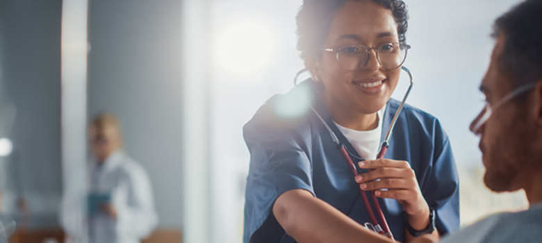 Provider listening to a patient's heart